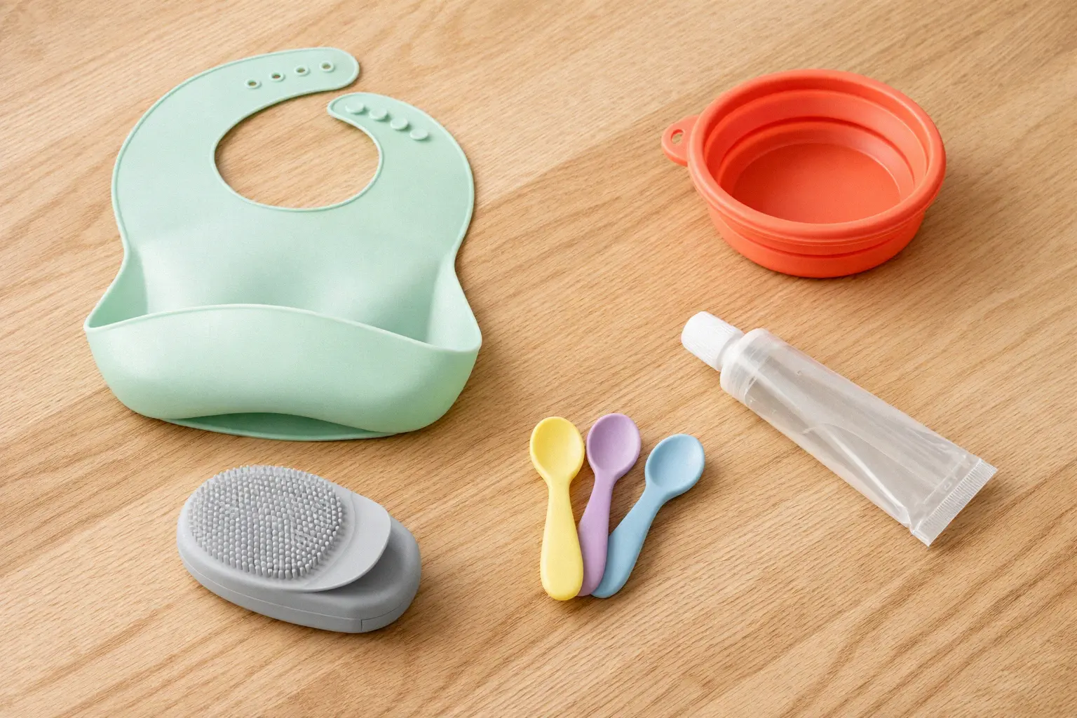 Collection of silicone home products including baby items cleaning tools pet accessories and auto parts arranged on a table