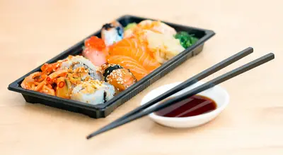 Silicone chopsticks photographed on a wooden kitchen countertop